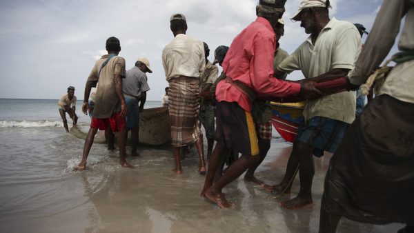 fishing from the beach with a net